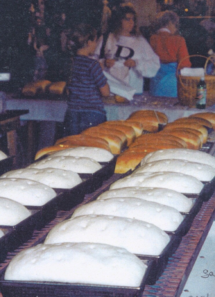 Bread has come out of the oven; another batch is ready to go in.