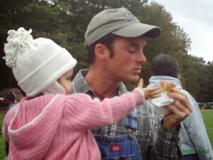 Alicen begs her father for a taste of bread.